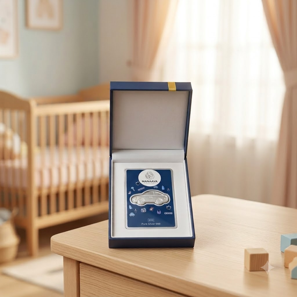 Manaaya car-shaped silver coin on a navy card in a cream box, surrounded by colourful nursery props